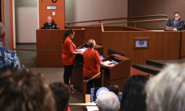 Representatives from the Huntington Beach Mobile Home Residents Coalition speak at a Huntington Beach City Council meeting in Huntington Beach, Calif., on July 19, 2022. (Julianne Foster/The Epoch Times)