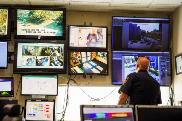 Police Lt. Jeffry Thoelen looks at live street camera monitors in the command room at Middletown Police Department in Middletown, New York, on Sept. 9, 2022. (Cara Ding/The Epoch Times)