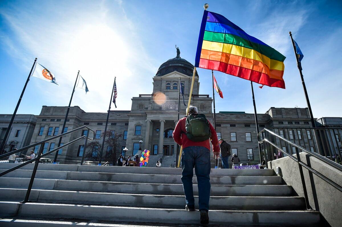 Demonstrators gather on the steps of the Montana State Capitol protesting anti-LGBT legislation in Helena, Montana on March 15, 2021. (Thom Bridge/Independent Record via AP)