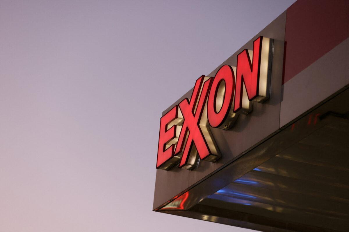 Signage at an Exxon gas station in Brooklyn, New York, on Nov. 23, 2021. (Andrew Kelly/Reuters)