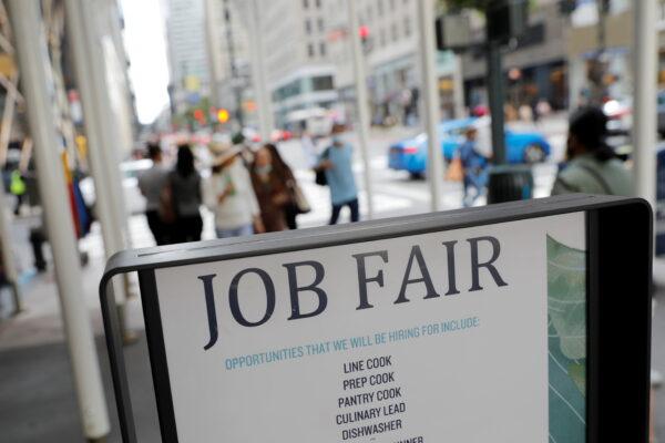 Signage for a job fair in New York City, on Sept. 3, 2021. (Andrew Kelly/Reuters)