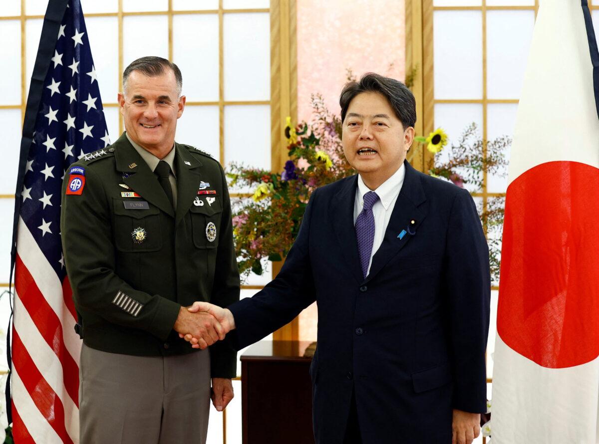 U.S. Army Pacific Commanding General Charles A. Flynn shakes hands with Japan's Foreign Minister Yoshimasa Hayashi in Tokyo, Japan, on Sept. 9, 2022. (Kim Kyung-Hoon/Reuters)