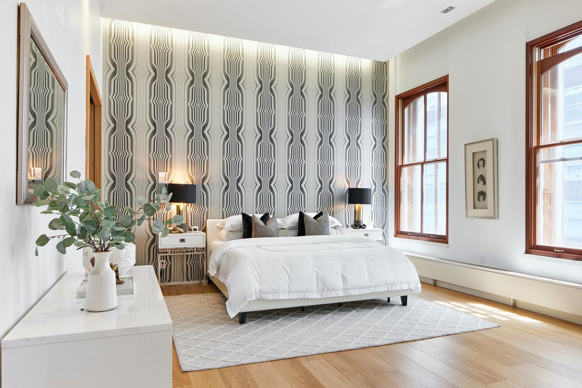 Wallpaper is a bold print adds both height and drama in this master bedroom. (TNS)