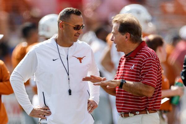 Head coach Steve Sarkisian of the Texas Longhorns talks with head coach Nick Saban of the Alabama Crimson Tide before the game at Darrell K Royal–Texas Memorial Stadium in Austin, Tex., September 10, 2022. (Tim Warner/Getty Images)