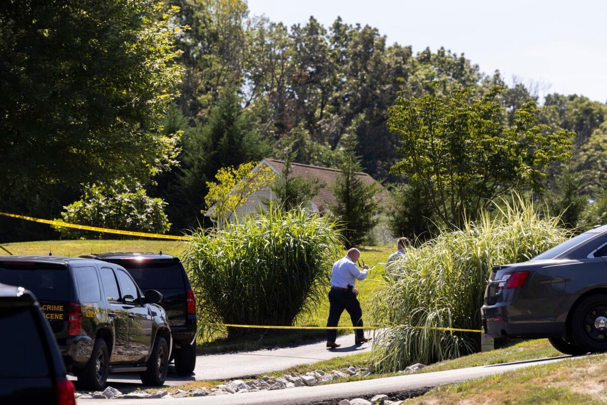 Law enforcement gather at the scene of a shooting in Elk Mills, Md., on Sept. 9, 2022. (Ryan Collerd/AP Photo)