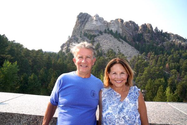 Kate and Jim Denker of New Jersey made their first visit to Mount Rushmore in Keystone, S.D., after years of waiting, on Sept. 7, 2022. (Allan Stein/The Epoch Times)
