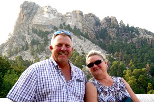 Doug and Cindy Alford of Texas near Mount Rushmore in Keystone, S.D., on Sept. 7, 2022. (Allan Stein/The Epoch Times)