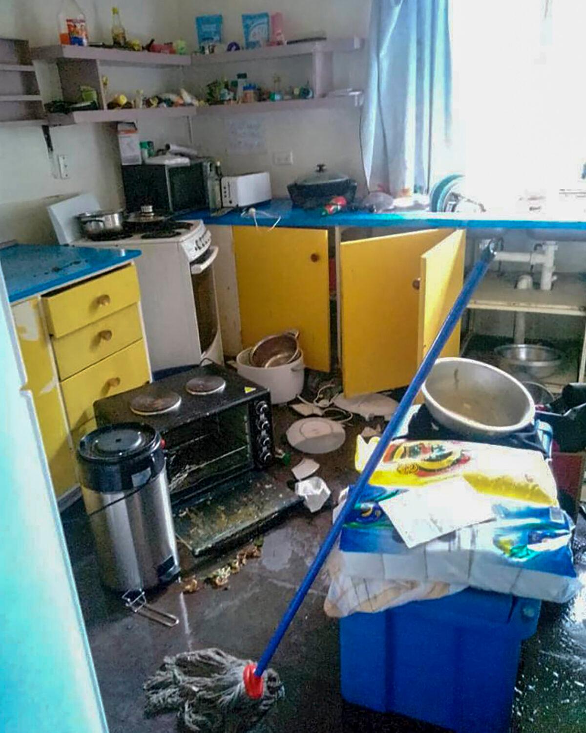 Debris lies strewn across the floor in the kitchen of Renagi Ravu's house in the town of Kainantu, following a strong earthquake in northeastern Papua New Guinea, on Sept. 11, 2022. (Renagi Ravu via AP)