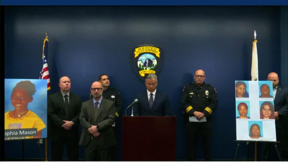 California Attorney General Rob Bonta (C) and police officers at a news conference on Sept. 11. 2022. (California Department of Justice)