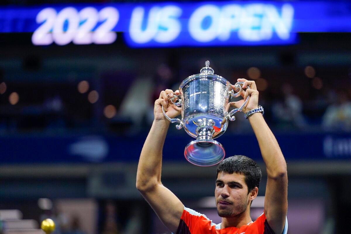 Carlos Alcaraz of Spain holds up the championship trophy after defeating Casper Ruud of Norway in the men's singles final of the U.S. Open tennis championships in New York on Sept. 11, 2022. (Matt Rourke/AP Photo)