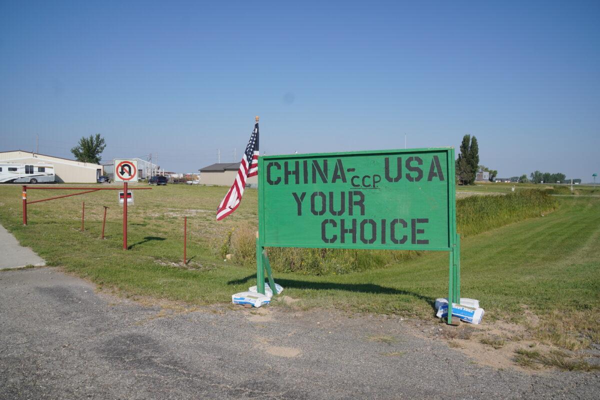  A sign opposing a corn mill in Grand Forks, N.D., stands near 370 acres recently annexed by the city for the project. Many residents don't want the project in the city because the owner has reputed ties to the Chinese Communist Party through its company chairman. (Allan Stein/The Epoch Times)