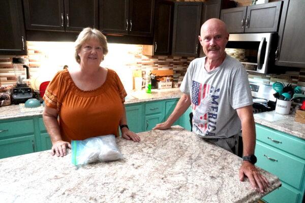 Tom and Mary Soulsby traded their retirement home in Tennessee for a bunker home at Vivos xPoint near Edgemont, S.D. The couple said they love their fully applianced kitchen with a central dining island on Sept. 7. (Allan Stein/The Epoch Times)