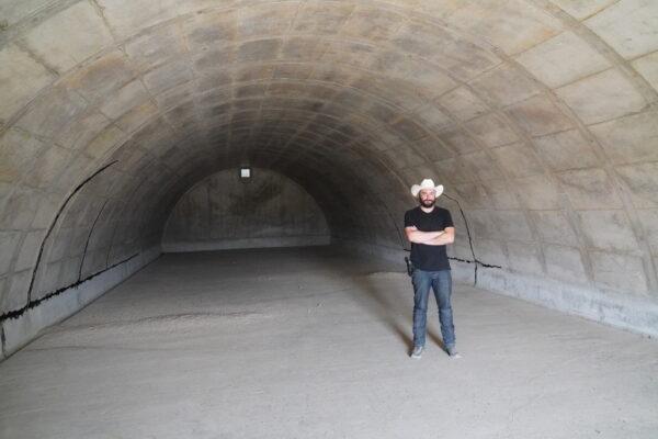 Vivos xPoint's Dante Vicino stands inside an unfinished bunker, one of 575 located on the former World War II military base outside of Edgemont, S.D., on Sept. 7. (Allan Stein/The Epoch Times)