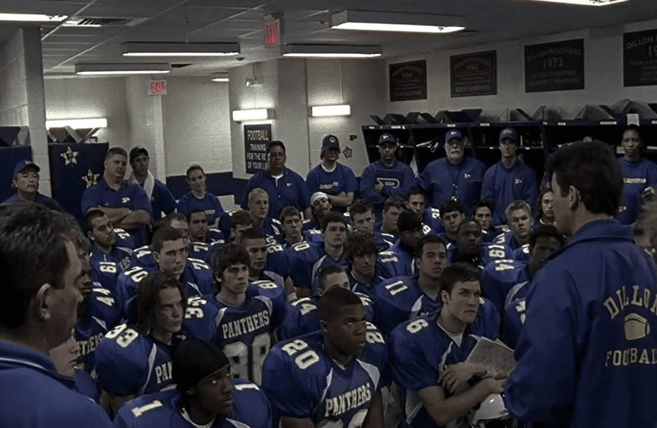 The head coach of the West Texas high school football team, the Dillon Panthers, is Eric Taylor (Kyle Chandler, R). He fires up his players in the first season of "Friday Night Lights." (Universal Television)