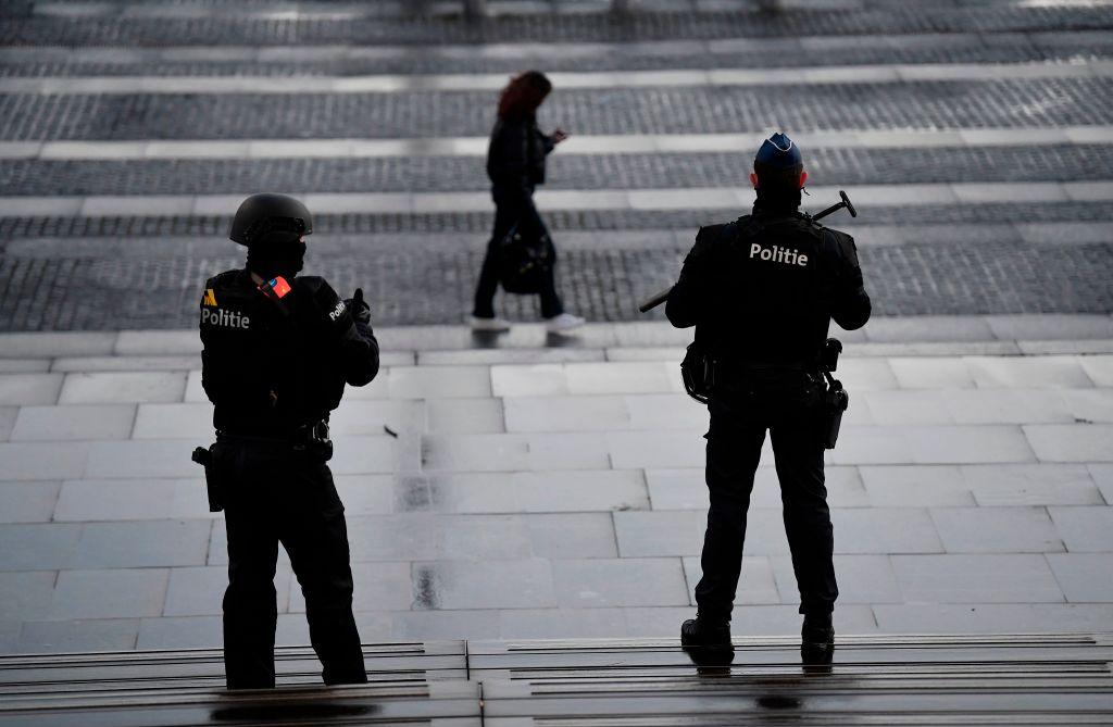 Belgian police officers stand guard at the entrance of the Antwerp courthouse, on February 4, 2021, during the trial of four suspects including an Iranian diplomat accused of taking part in a plot to bomb an opposition rally in France. (John Thys/AFP via Getty Images)