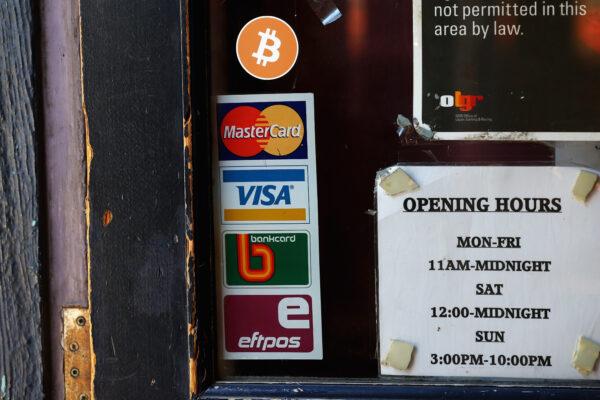 A sign displaying Bitcoins accepted is seen on the front door of the Old Fitzroy Pub in Sydney, Australia, on Sept. 19, 2013. (Cameron Spencer/Getty Images)