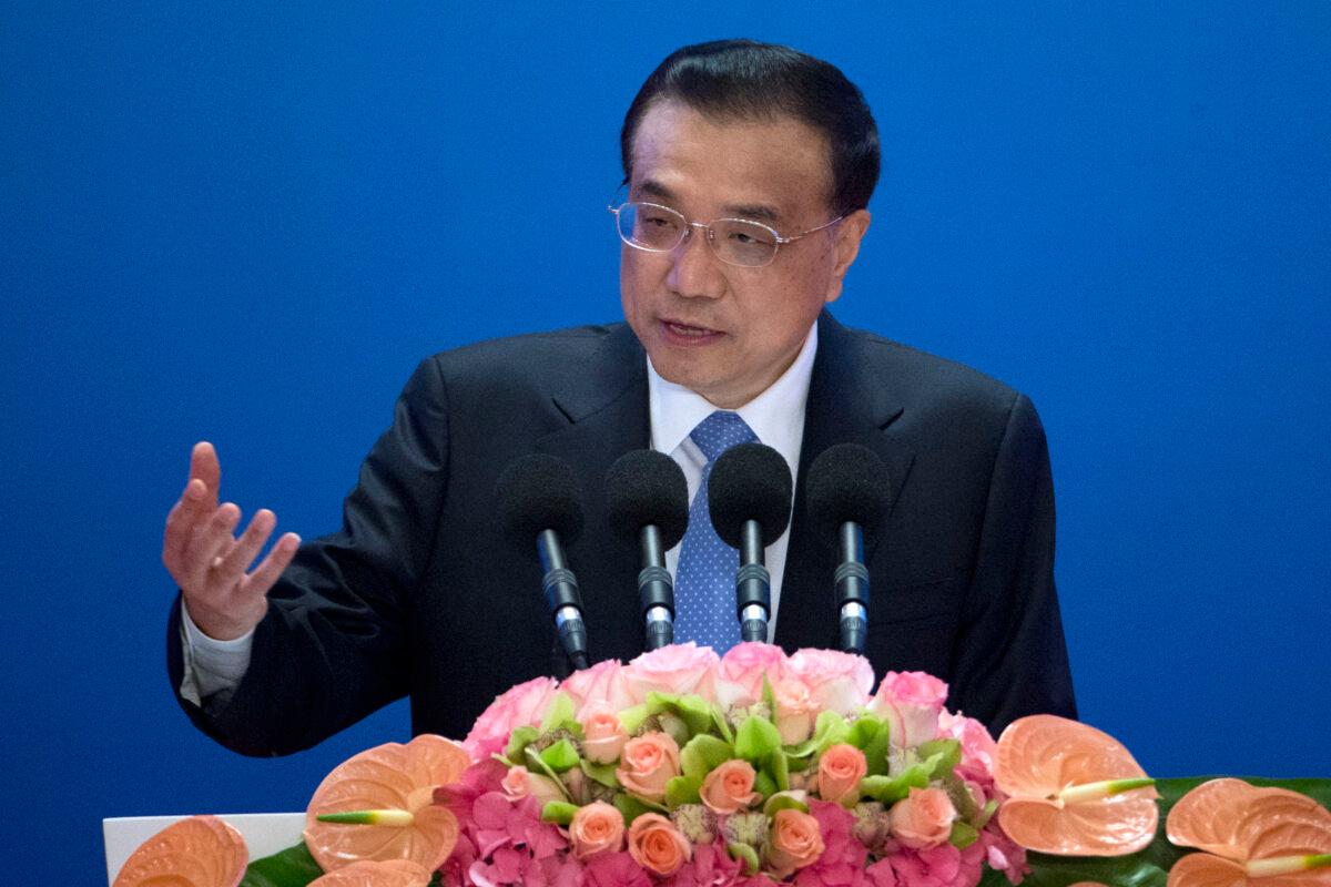 Chinese Premier Li Keqiang speaks as he arrives for the Inaugural Meeting of the Board of Governors of the Asian Infrastructure Investment Bank (AIIB) on January 16, 2016 in Beijing, China. (Mark Schiefelbein - Pool/Getty Images)