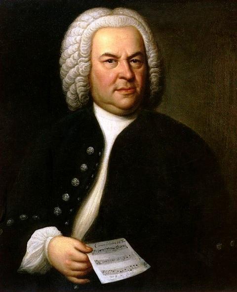 Johann Sebastian Bach (aged 61) in a portrait by Elias Gottlob Haussmann, second version of his 1746 canvas. Bach is holding a copy of the six-part canon BWV 1076.