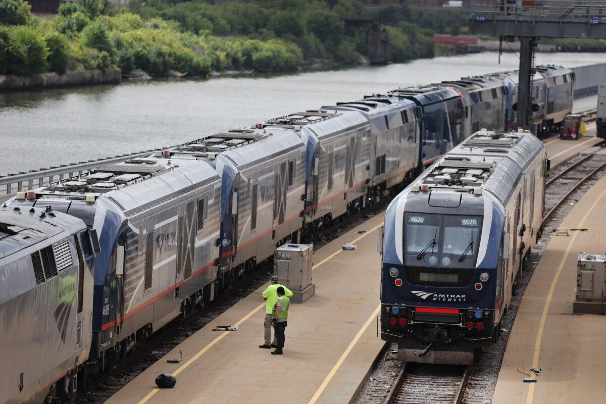 Workers service trains in the Amtrak Car Yard south of the Loop in Chicago on Sept. 13, 2022. (Scott Olson/Getty Images)