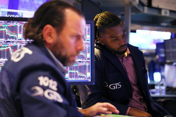 Traders work on the floor of the New York Stock Exchange during afternoon trading, in New York City, on Sept. 13, 2022. (Michael M. Santiago/Getty Images)