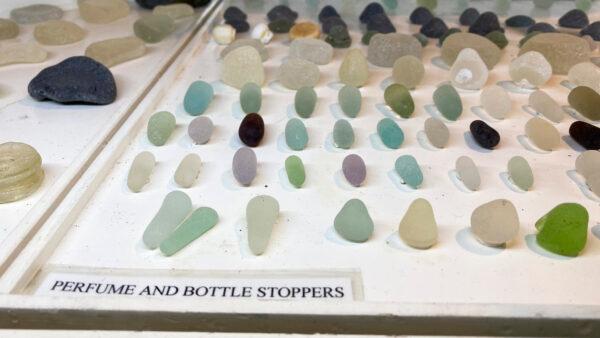 Glass perfume and bottle stoppers on display at the Sea Glass Museum in Fort Bragg, Calif., on Sept. 5, 2022. (Ilene Eng/NTD)