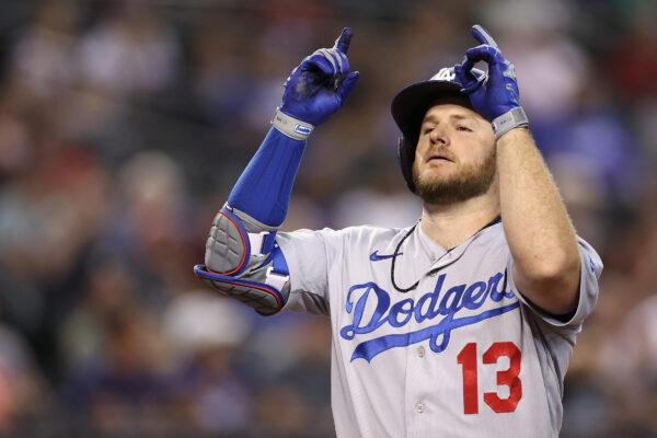 Max Muncy (13) of the Los Angeles Dodgers celebrates after a solo home run against the Arizona Diamondbacks during the seventh inning of the MLB game at Chase Field in Phoenix, Sept. 13, 2022. (Christian Petersen/Getty Images)