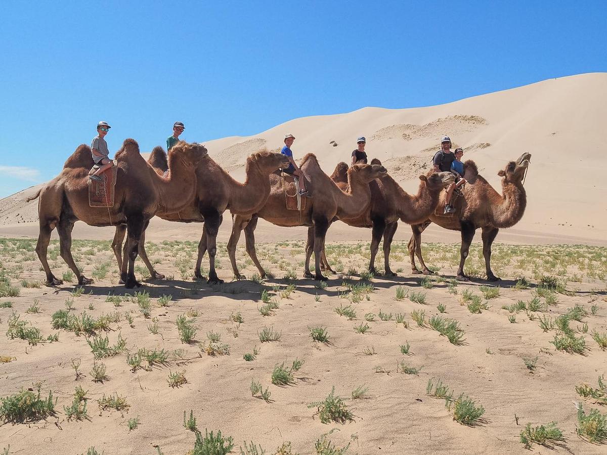 The family enjoy a camel ride in Gobi Desert, Mongolia. (Courtesy of Edith Lemay)