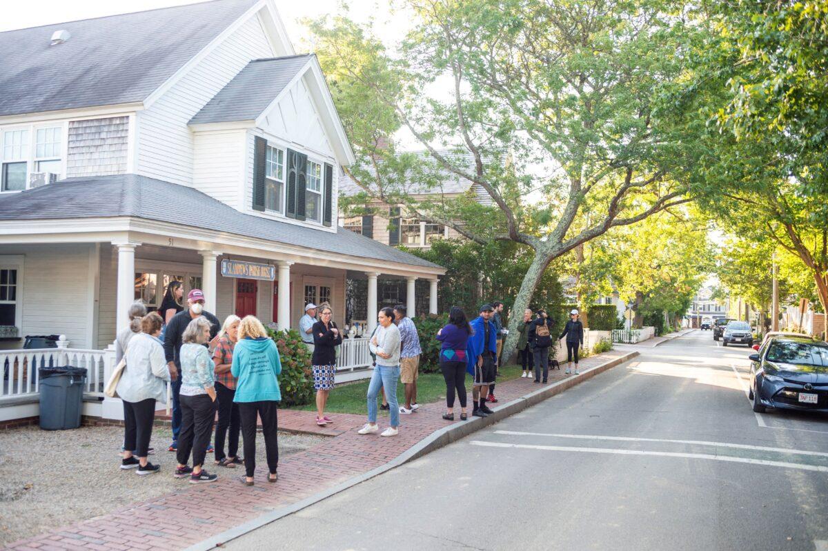 Illegal immigrants gather, after being flown in from Texas on a flight funded by Florida Gov. Ron DeSantis, at Edgartown on Martha's Vineyard, Mass., on Sept. 15, 2022. (Vineyard Gazette/Handout via Reuters)