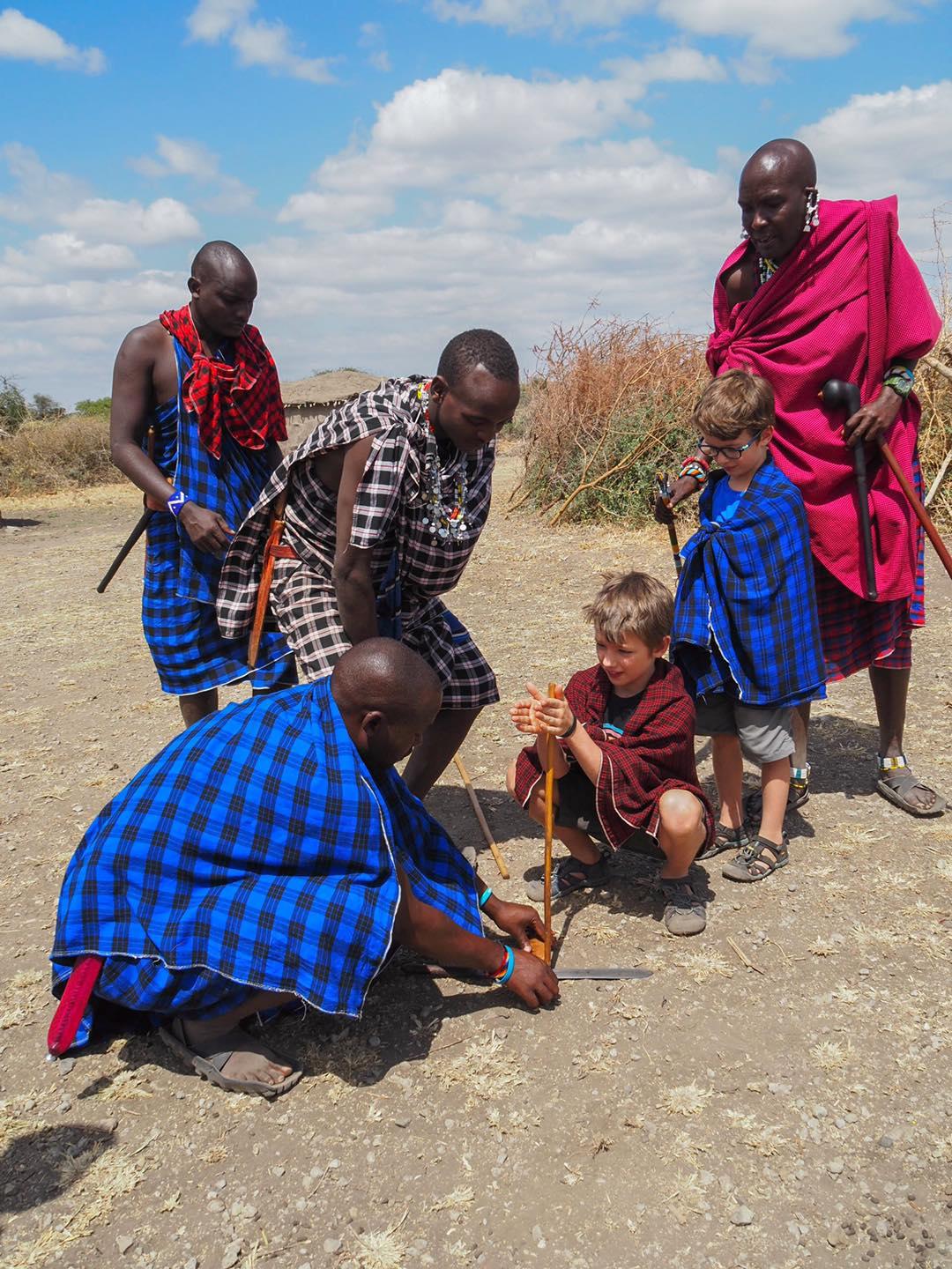The kids interact with locals in Maasai village, Tanzania. (Courtesy of Edith Lemay)