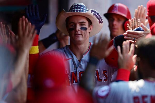 Los Angeles Angels' Mickey Moniak is congratulated in the dugout after hitting a two-run home run offCleveland Guardians starting pitcher Cal Quantrill during the third inning of a baseball game in Cleveland, Sept. 14, 2022. (David Dermer/AP Photo)