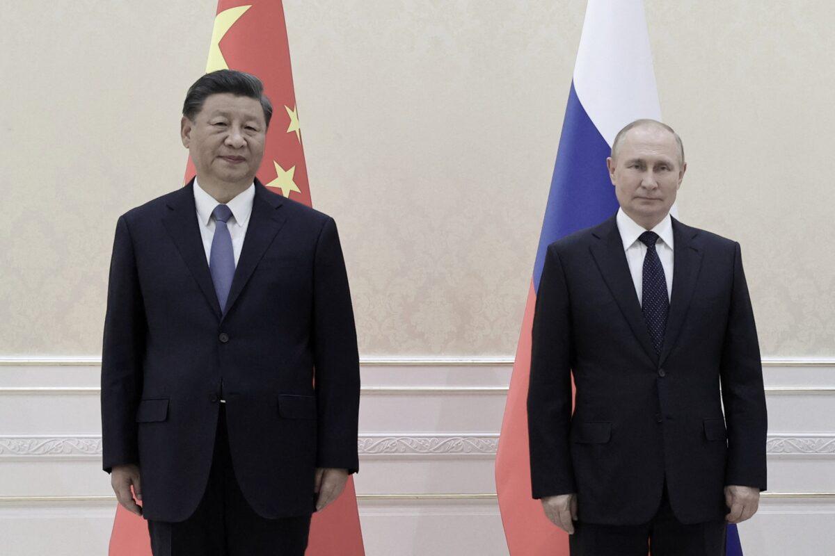 Chinese leader Xi Jinping and Russian President Vladimir Putin pose for photos on the sidelines of the Shanghai Cooperation Organization (SCO) leaders’ summit in Samarkand, Uzbekistan, on Sept. 15, 2022. (Alexandr Demyanchuk/Sputnik/AFP via Getty Images)