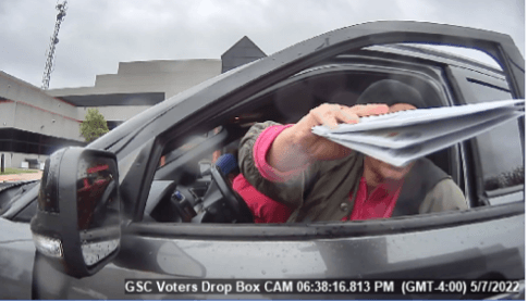 An individual is captured on camera delivering more than two ballots at the drop box at 601 Westtown Road, West Chester, Pennsylvania, in May 2022. (America First Legal)