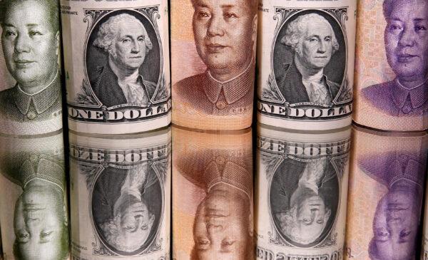 Chinese yuan and U.S. dollar banknotes on Feb. 10, 2020. (Dado Ruvic/Illustration/Reuters)