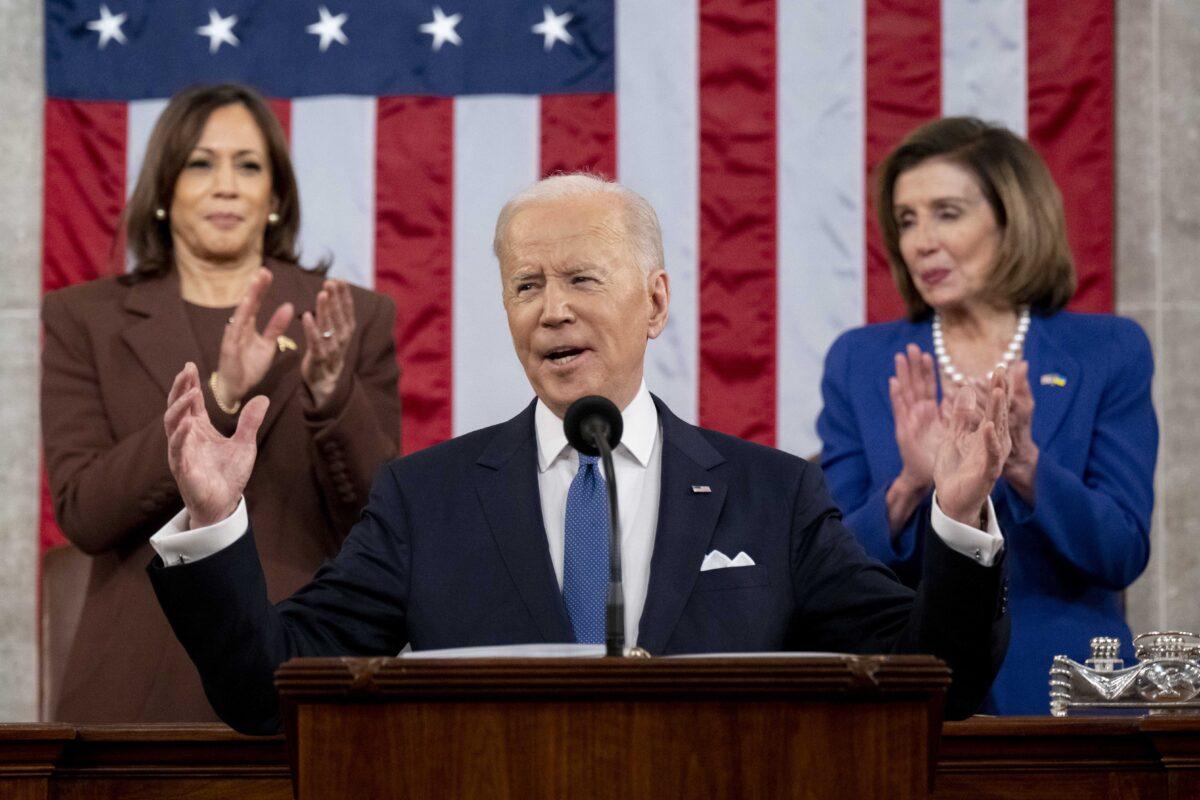 President Joe Biden arrives to deliver the State of the Union address as Vice President Kamala Harris (L) and House Speaker Nancy Pelosi (D-Calif.) look on during a joint session of Congress in the U.S. Capitol House Chamber in Washington, on Mar. 1, 2022. (Saul Loeb/Pool/Getty Images)
