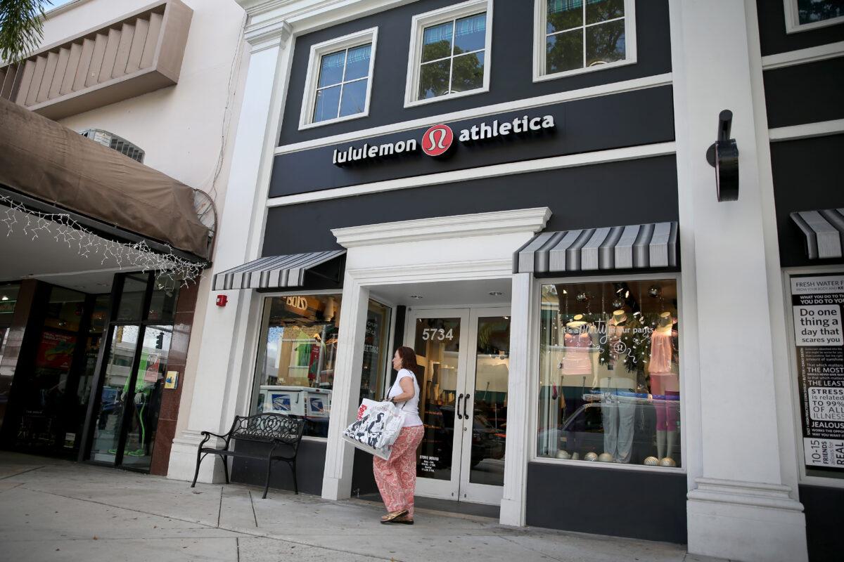 A woman walks past a Lululemon Athletica store in Miami, Fla., on Dec. 10, 2013. (Joe Raedle/Getty Images)