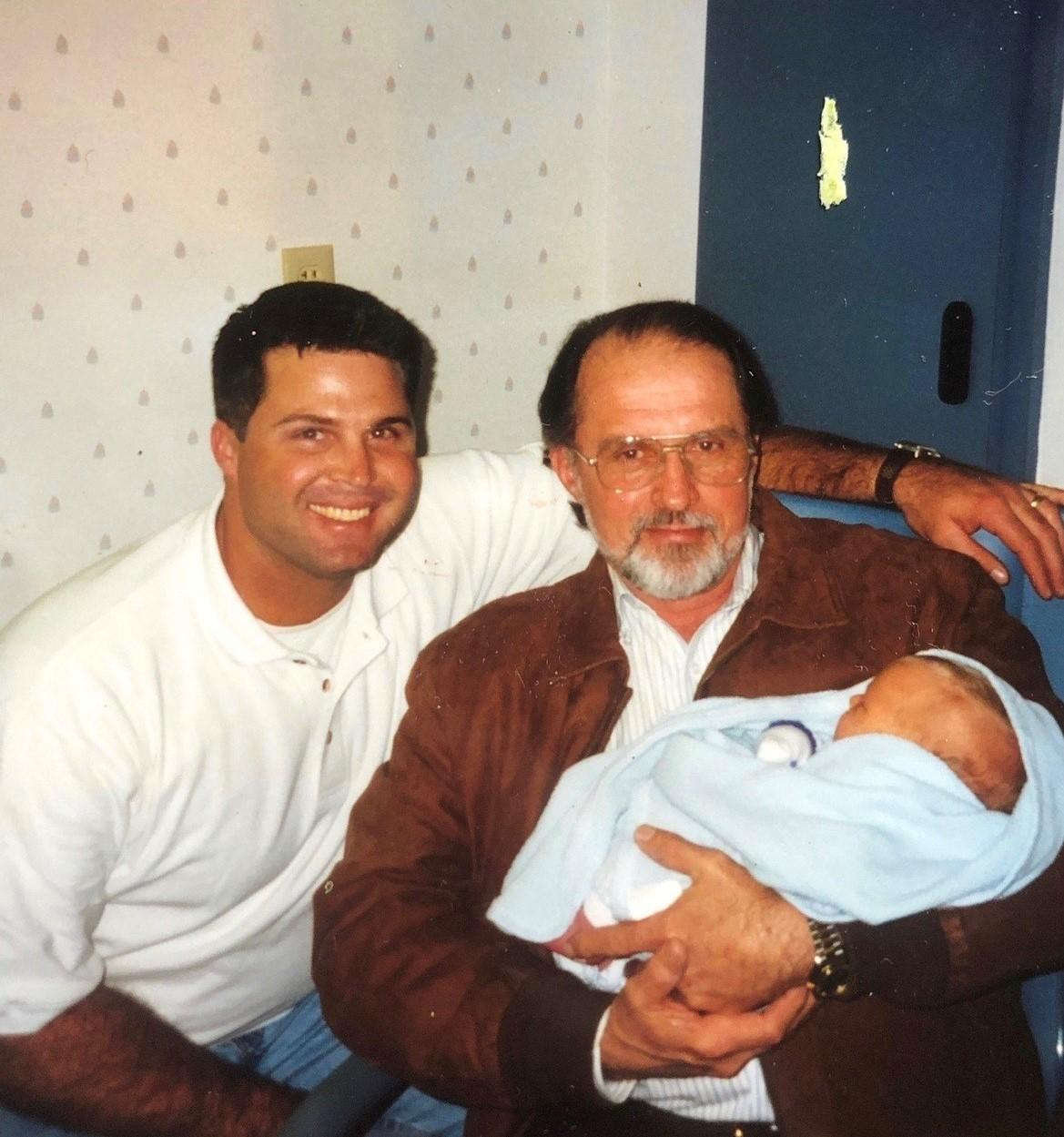  Michael Sr. and Kenneth with Michael Jr. in his arms. (Courtesy of <a href="https://www.instagram.com/mtoddhaworth/">Michael Todd Haworth</a>)