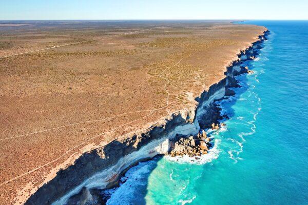 Drone image of the Bunda Cliffs, where the Nullarbor Plain meets the Great Australian Bight. Layering in the cliffs represent different limestone units. (Courtesy of Matej Lipar)