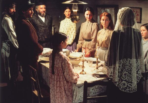  Tevye's family prays before sitting down to a Passover meal in Tsarist Russia, in "Fiddler on the Roof." (MovieStillsDB)