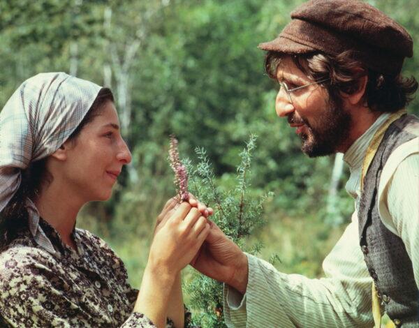 Rosalind Harris as Tzeitel, the oldest daughter, and Leonard Frey as Motel Kamzoil, the tailor, Tzeitel's eventual husband, pledge their troth in "Fiddler on the Roof." (MovieStillsDB)