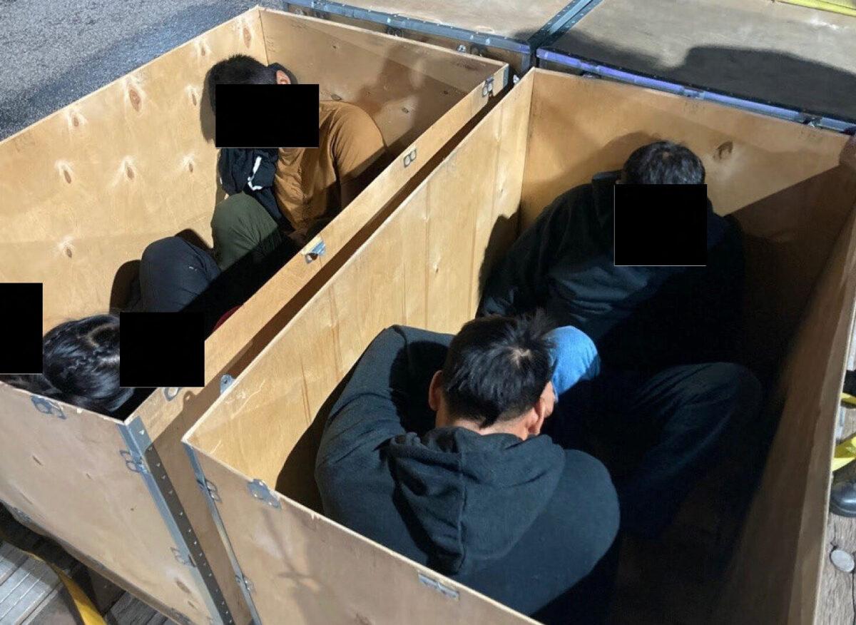  Illegal immigrants who are believed to have crossed the border from Mexico into the United States are seen inside wooden boxes in Laredo, Texas, on Sept. 13, 2022. (Department of Justice/Handout via Reuters)