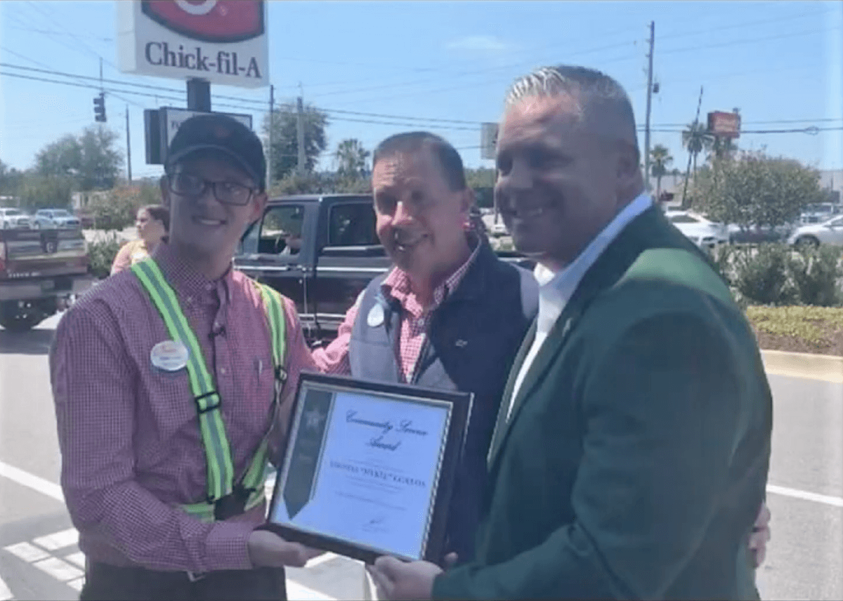 A Florida Chick-fil-A employee, Mykel Gordan, is presented with an Okaloosa County Sheriff's Office Community Service Award. (Courtesy of Okaloosa County Sheriff’s Office)