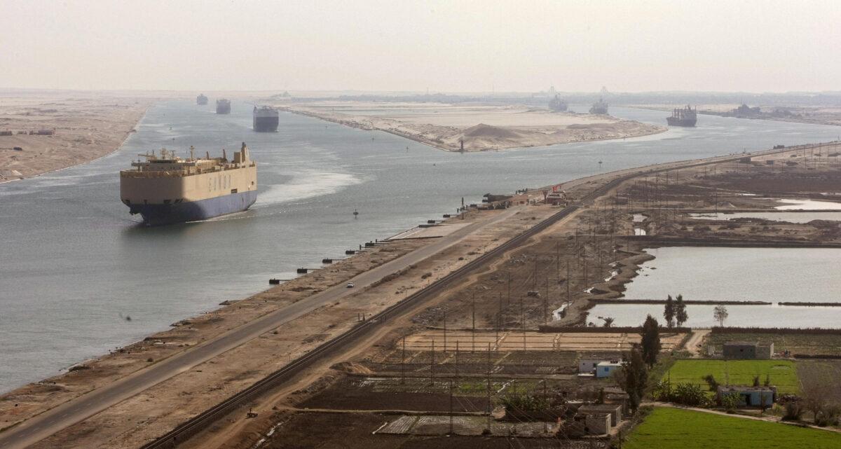 Cargo ships navigate in the Suez Canal between Port Said and Ismailia, about 62 miles northeast of Cairo, on Nov. 24, 2008. (Cris Bouroncle/AFP via Getty Images)