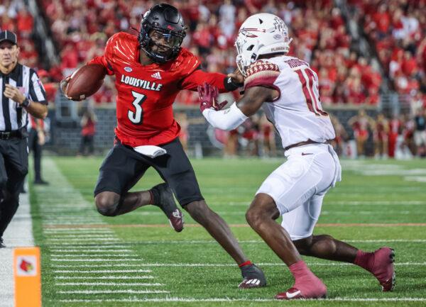 Malik Cunningham (3) of the Louisville Cardinals runs the ball against Jammie Robinson (10) of the Florida State Seminoles during the first half at Cardinal Stadium in Louisville, Ky., on Sept. 16, 2022. (Michael Hickey/Getty Images)