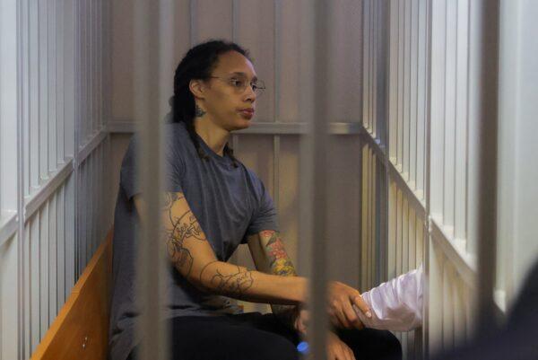 Basketball player Brittney Griner, who was detained at Moscow's Sheremetyevo airport and later charged with illegal possession of cannabis, sits inside a defendants' cage after the court's verdict in Khimki outside Moscow on Aug. 4, 2022. (Evgenia Novozhenina/Reuters)