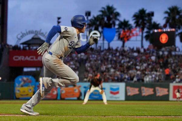 Los Angeles Dodgers' Freddie Freeman runs to first base after hitting an RBI single during the third inning of a baseball game against the San Francisco Giants in San Francisco, on Sept. 17, 2022. (Jeff Chiu/AP Photo)