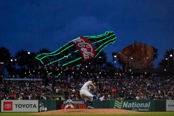 Los Angeles Dodgers' Julio Urias, bottom, pitches against the San Francisco Giants during the third inning of a baseball game in San Francisco, on Sept. 17, 2022. (Jeff Chiu/AP Photo)
