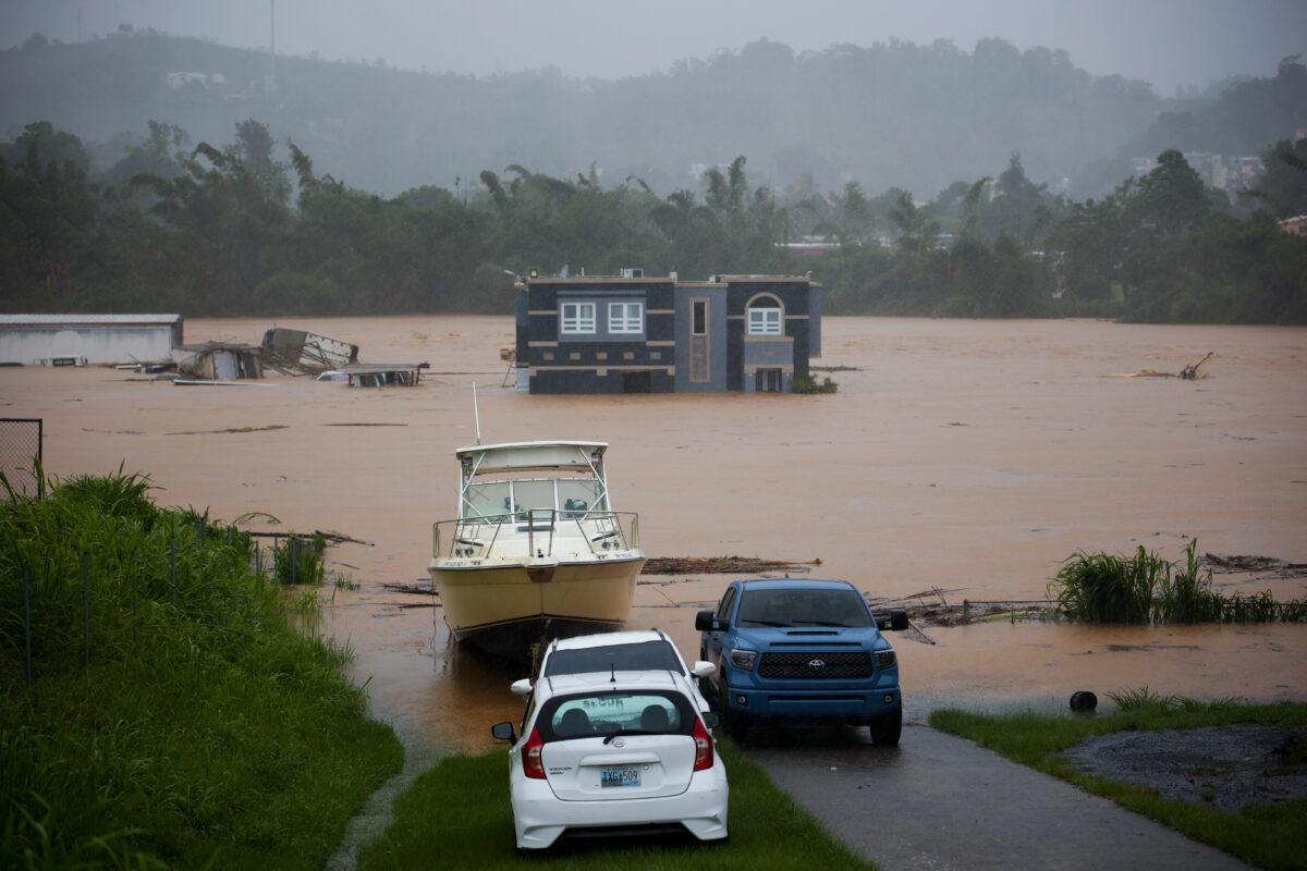 A home is submerged in floodwaters caused by Hurricane Fiona in Cayey, Puerto Rico, on Sept. 18, 2022. (Stephanie Rojas/AP Photo)