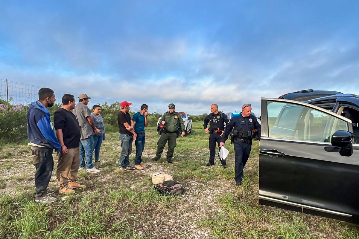 Border Patrol takes into custody six illegal immigrants who were being smuggled from the U.S.–Mexico border, through Kinney County, Texas, on Aug. 28, 2022. (Charlotte Cuthbertson/The Epoch Times)