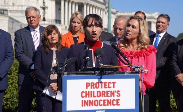 Chloe Cole, an ex-transgender teen, speaks in support of the Protect Children's Innocence as Rep. Marjorie Taylor Greene (R-Ga.) looks on outside the U.S. Capitol in Washington on Sept. 20, 2022. (Terri Wu/The Epoch Times)