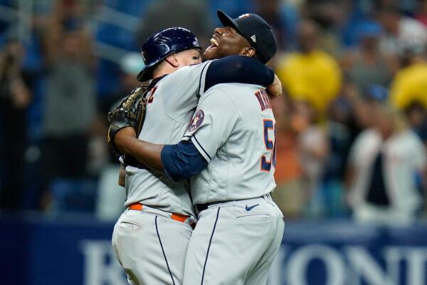  Houston Astros relief pitcher Hector Neris (50) hugs catcher Christian Vazquez after the team defeated the Tampa Bay Rays during a baseball game in St. Petersburg, Fla., Sept. 19, 2022. (Chris O'Meara/AP Photo)